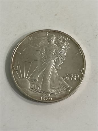 1 ounce fine silver 1989 Dollar pop (L)