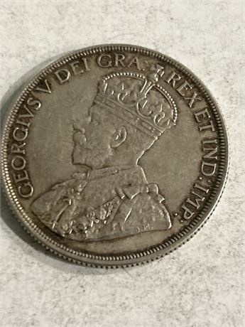 Canadian silver dollar 1936( 18.66 silver ) (L)